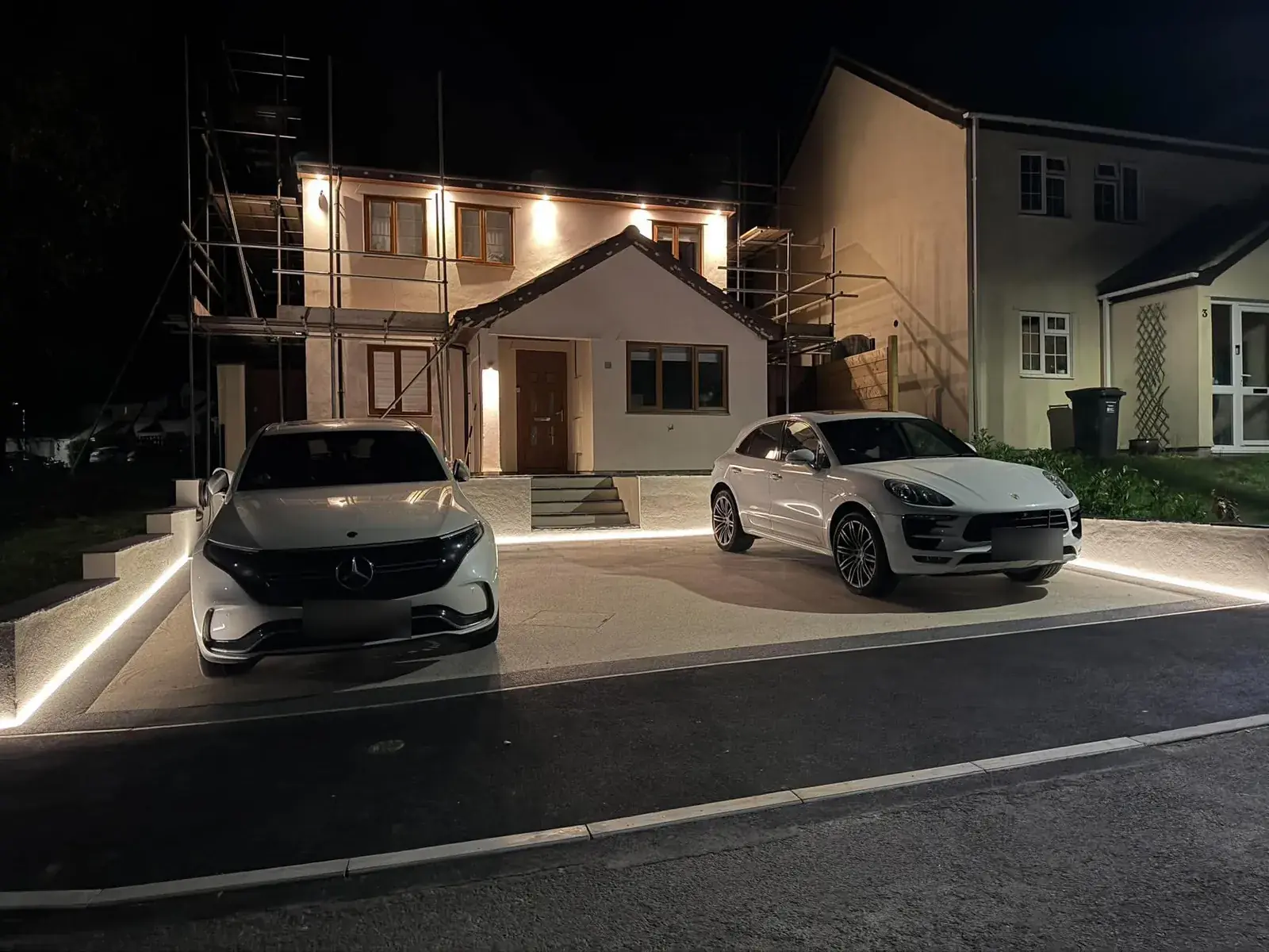 Driveway perimeter LEDs — Recessed strip along the drive edge